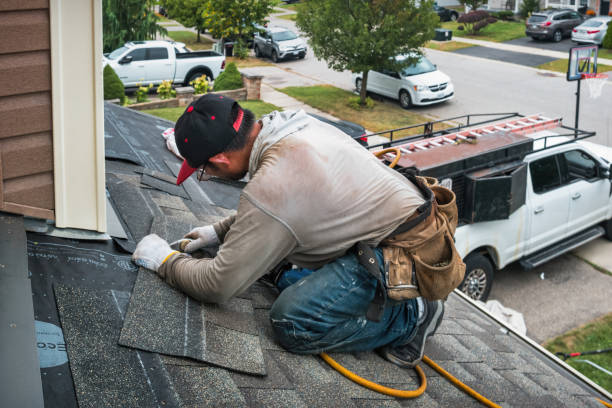 Professional Roofing technician working in Swisshome, OR